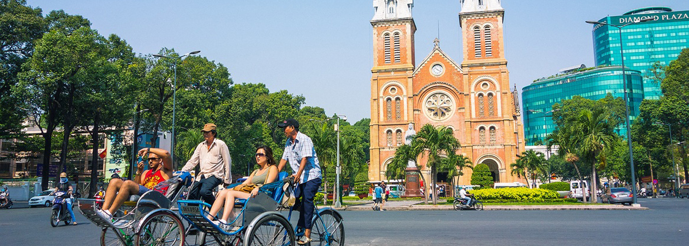 Tourist are on cyclos in Saigon 